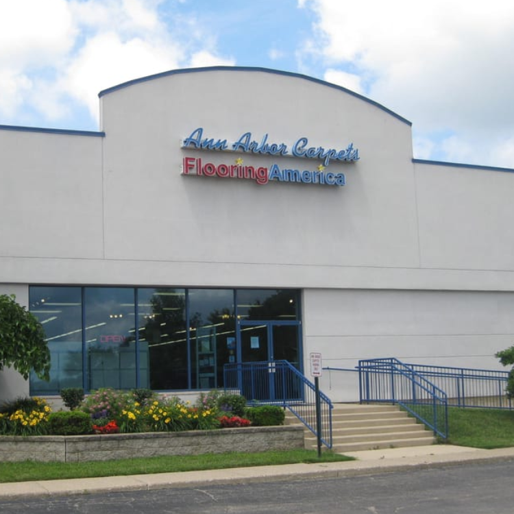 Father and son playing on the hardwood flooring.