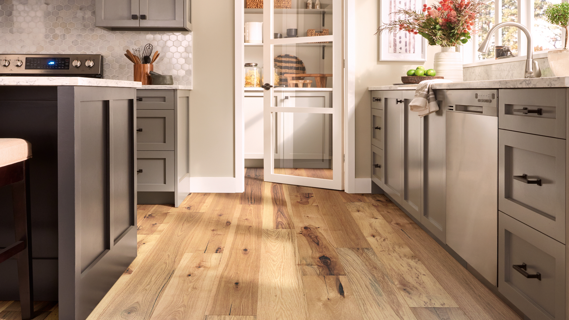 light toned hardwood flooring with beautiful knotting in a bright kitchen